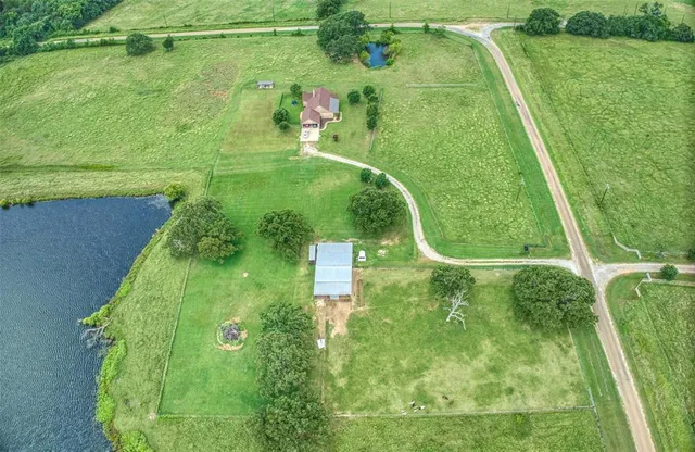 a view of a house with a big yard