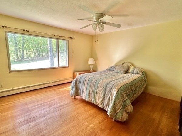 44 Hampton Knolls Road Holyoke, MA 01040 - Photo 17 of 42 a bedroom with a bed and a chandelier