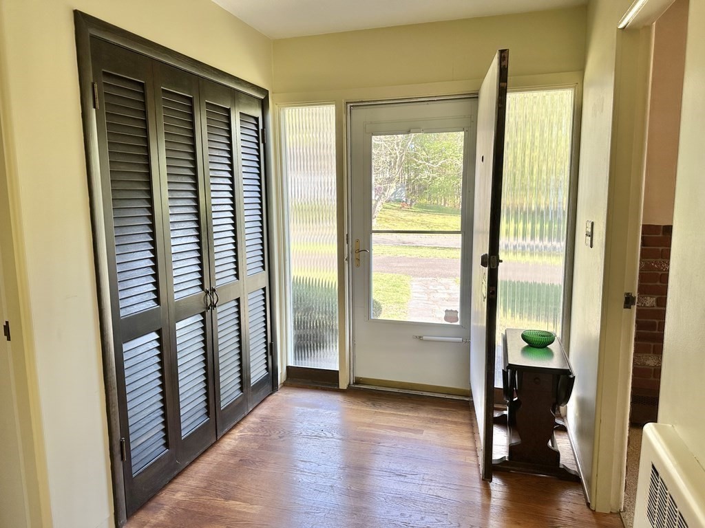 44 Hampton Knolls Road Holyoke, MA 01040 - Photo 10 of 42 a view of a hallway with wooden floor and stairs