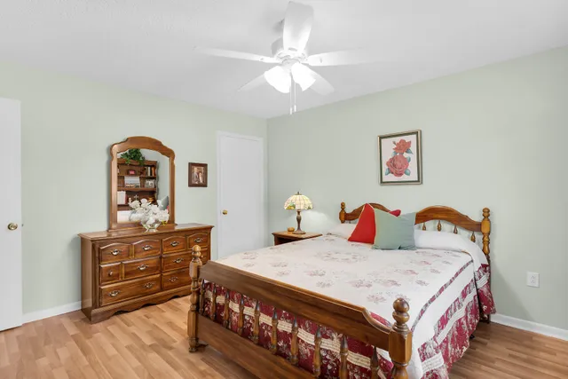 a bedroom with a bed and a dresser