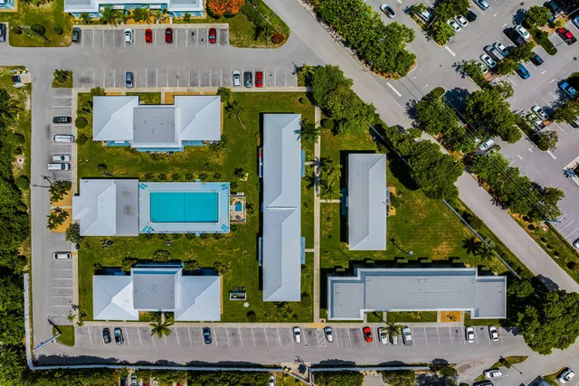 an aerial view of residential houses with outdoor space