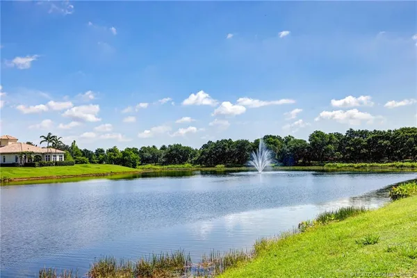 a view of a lake with houses in the back