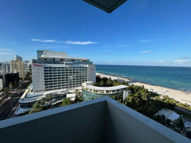 a view of a balcony with an ocean view