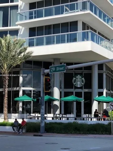 a front view of building with street view