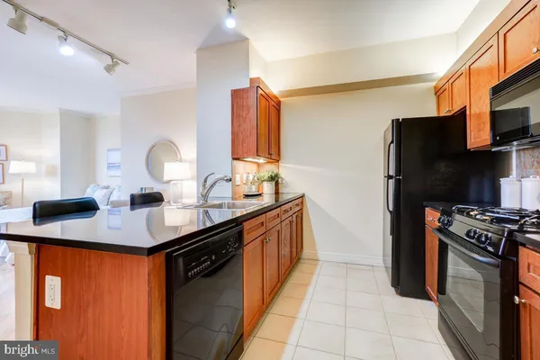 a spacious bathroom with a granite countertop sink a mirror and shower