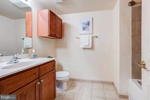 a bathroom with a sink a mirror and a shower