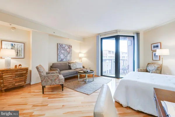 a view of a living room and a balcony