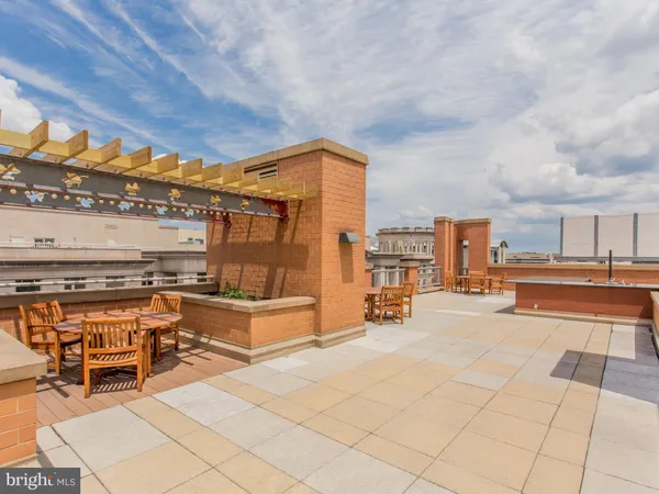 a swimming pool view with a outdoor seating