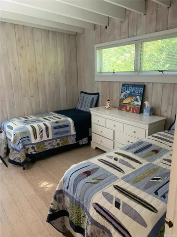 a bedroom with bed and window