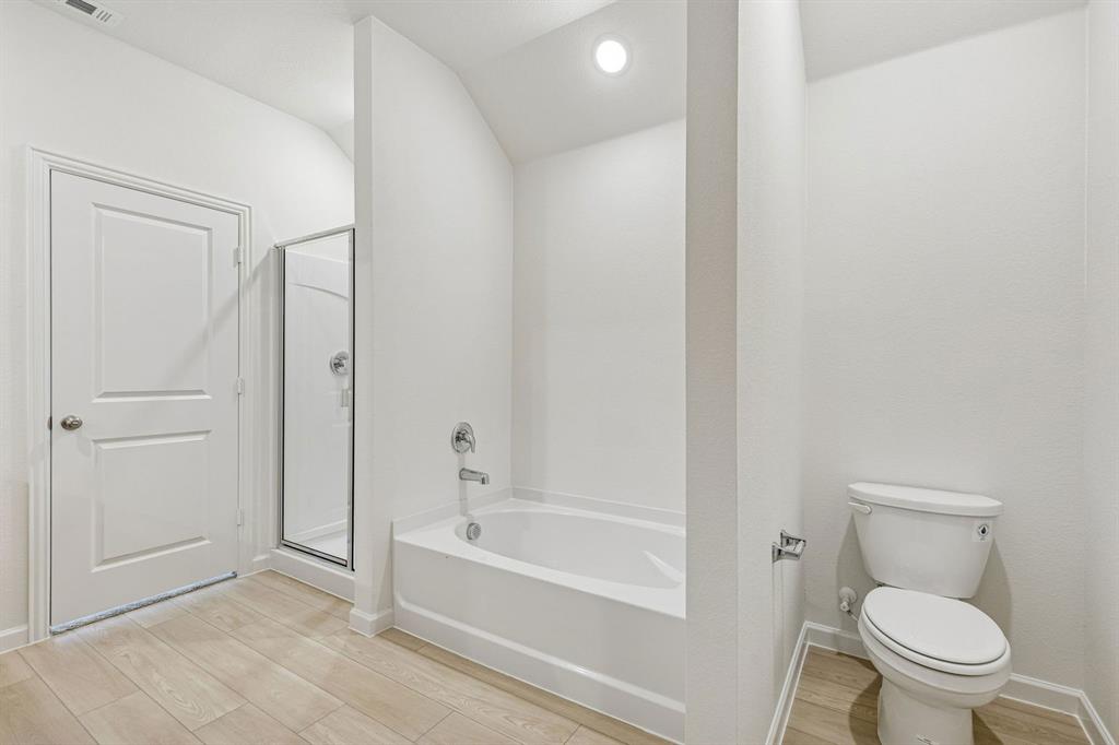 3820 Prairie Chapel Road Royse City, TX 75189 - Photo 11 of 18 a bathroom with a toilet and a bathtub