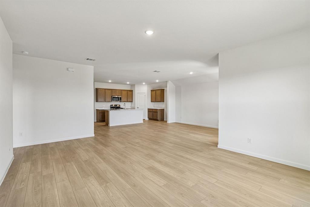 3820 Prairie Chapel Road Royse City, TX 75189 - Photo 7 of 18 a view of a kitchen with a refrigerator cabinets and a sink