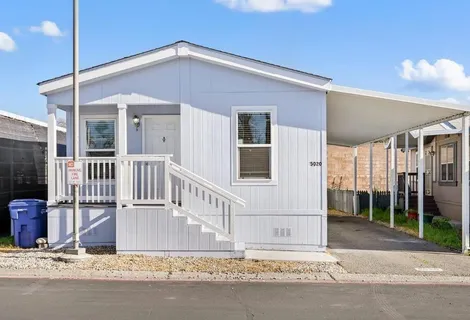 a front view of a house with a garage