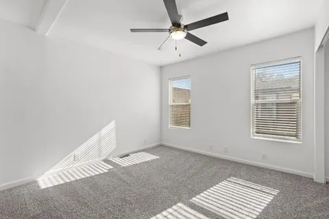 a view of livingroom with hardwood floor and a ceiling fan