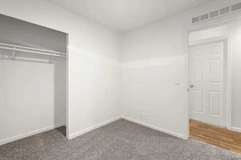 a bathroom with a shower a toilet and a sink