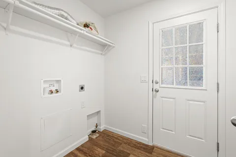 a bathroom with a granite countertop toilet and a sink
