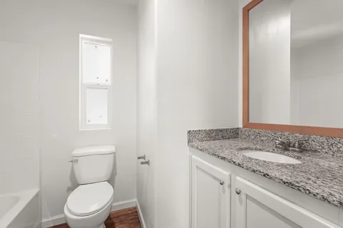 a view of a porch with wooden floor and stairs