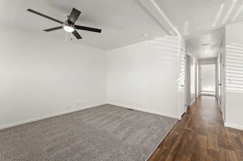 a kitchen with granite countertop a sink stove and refrigerator