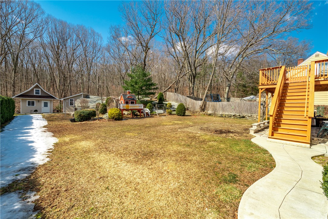 284 8th Avenue Woonsocket, RI 02895 - Photo 24 of 33 Back yard showing the child's play house, the smoker and the prep area