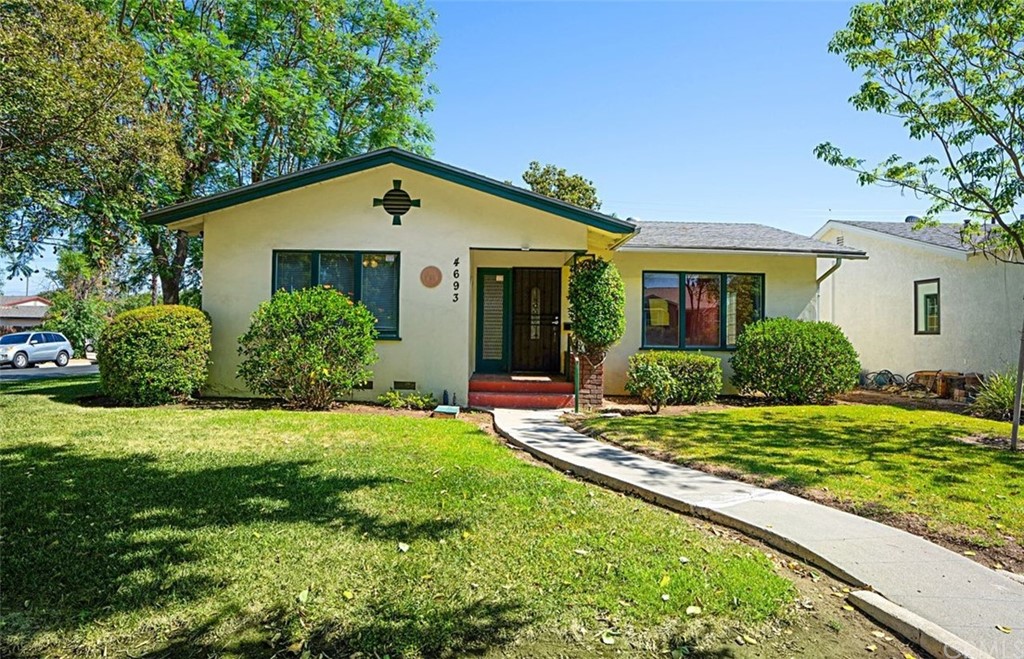 4693 Merrill Avenue Riverside, CA 92506 - Photo 1 of 1 a view of a house with a yard and potted plants