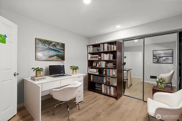 a workspace with furniture and bookshelf