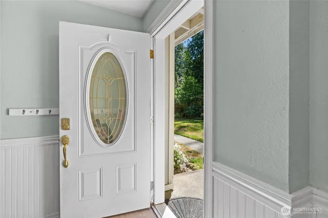 a view of a bedroom with washer and dryer
