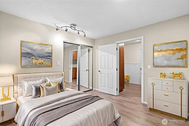 a bedroom with furniture and a chandelier