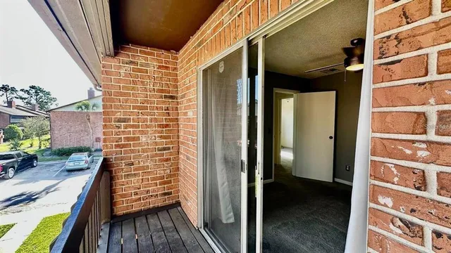 a view of a balcony and a potted plant