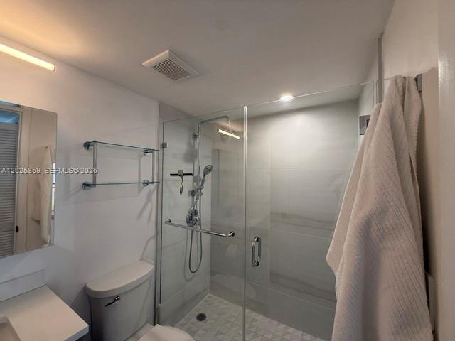 540 Brickell Key Drive, Unit 1024 Miami, FL 33131 - Photo 20 of 28 a bathroom with a shower and toilet