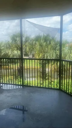 a view of balcony with yard