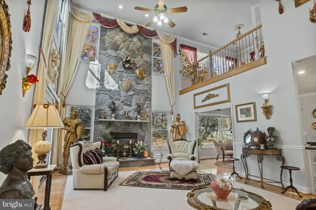 a living room with furniture and flowers