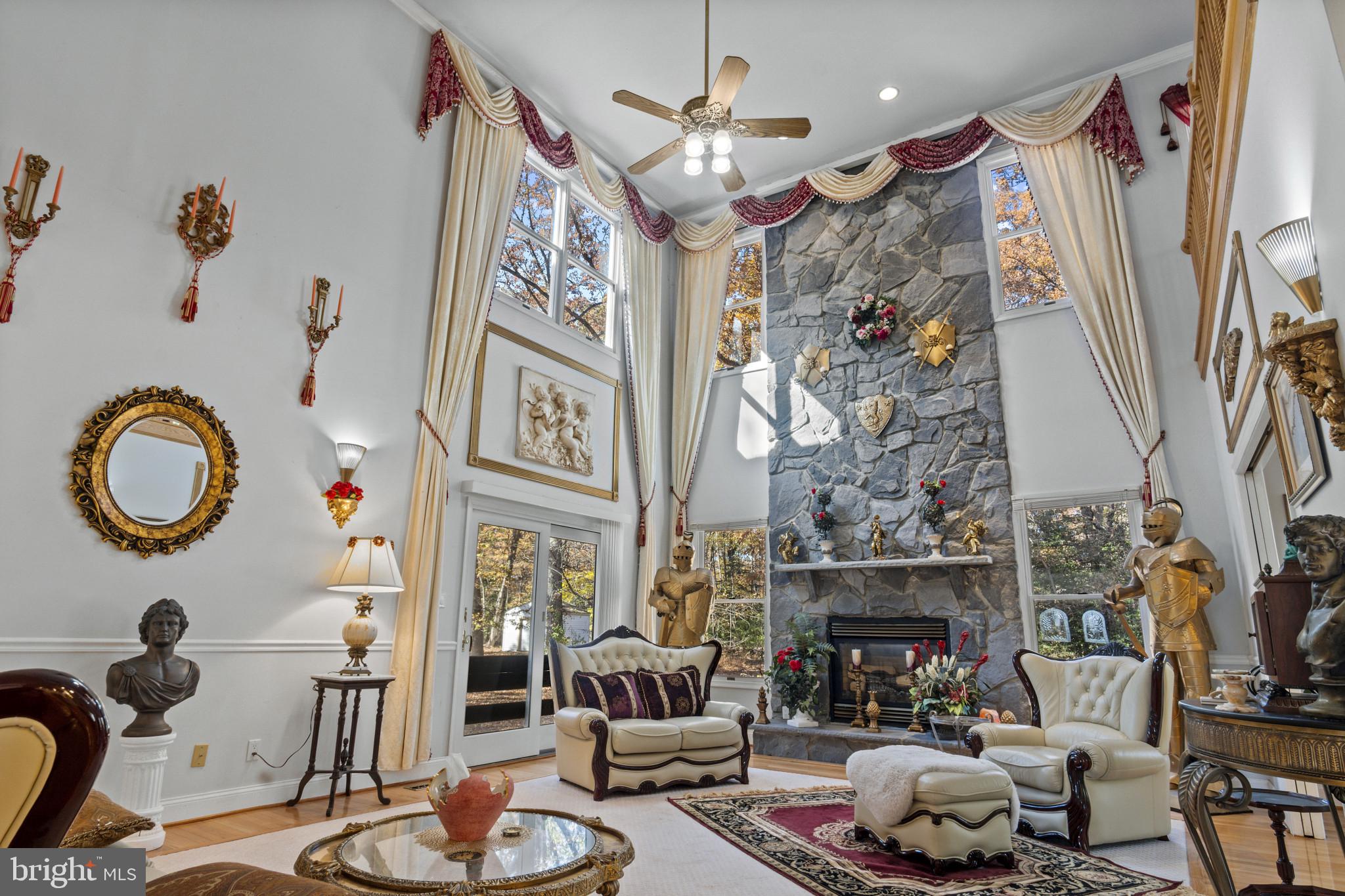 10900 Sunset Hills Road Reston, VA 20190 - Photo 21 of 62 a living room with furniture and a fireplace