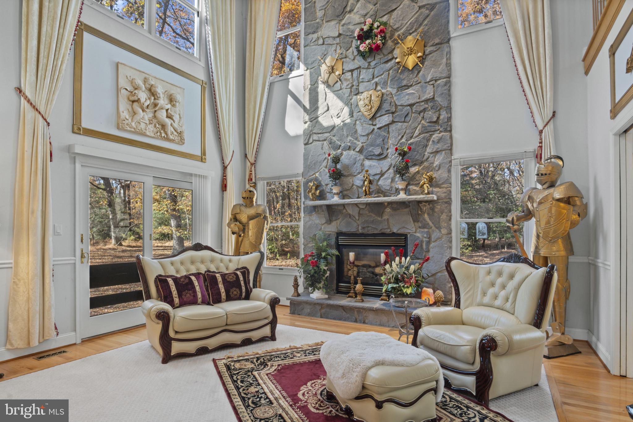 10900 Sunset Hills Road Reston, VA 20190 - Photo 22 of 62 a living room with furniture and a fireplace