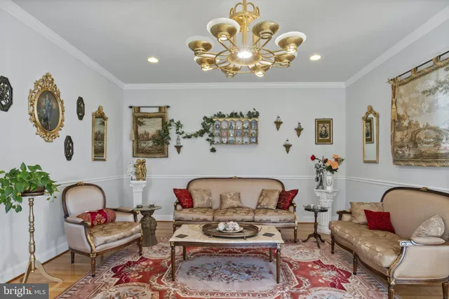 a living room with furniture and kitchen view