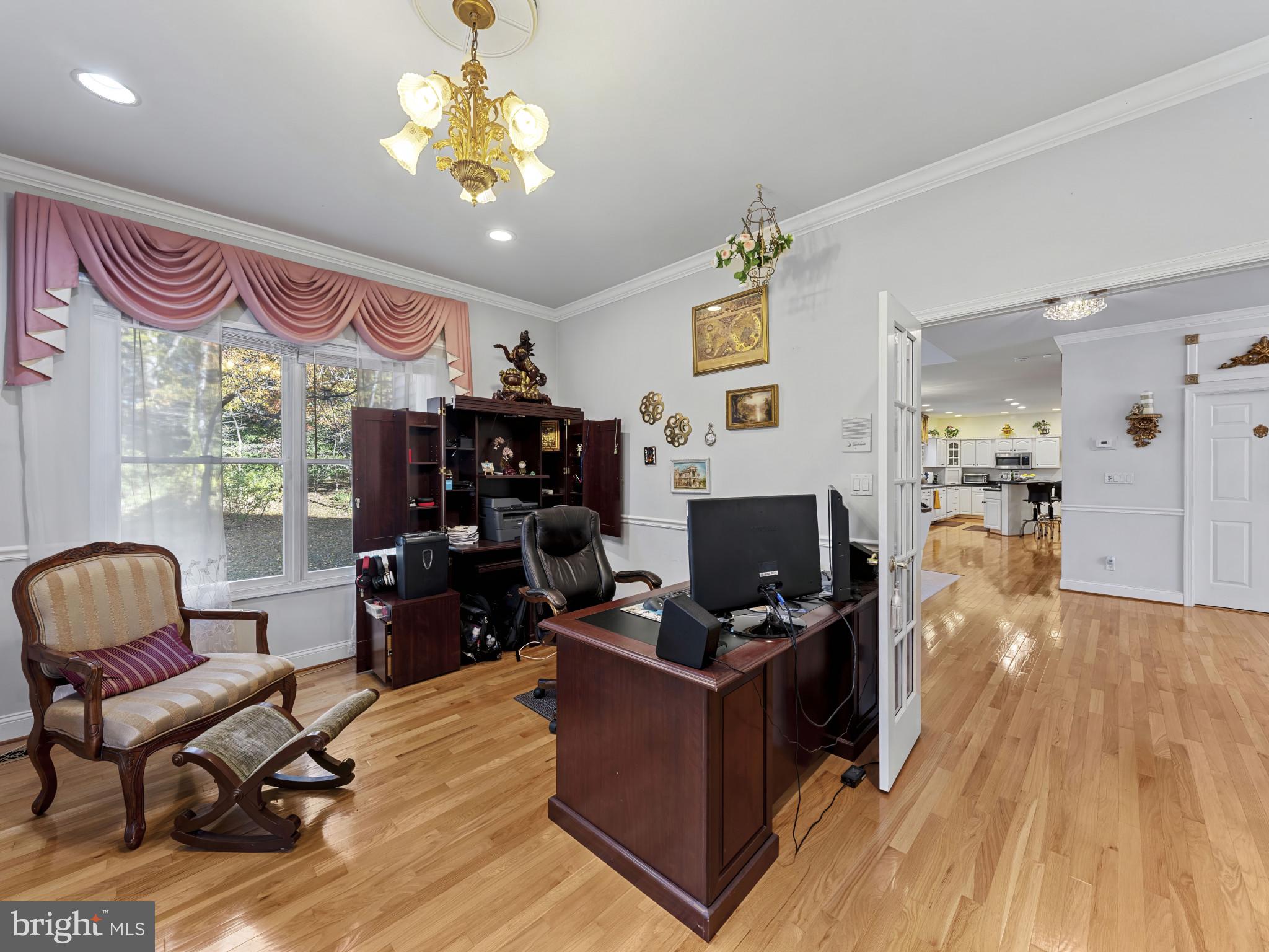 10900 Sunset Hills Road Reston, VA 20190 - Photo 27 of 62 a room with furniture and wooden floor