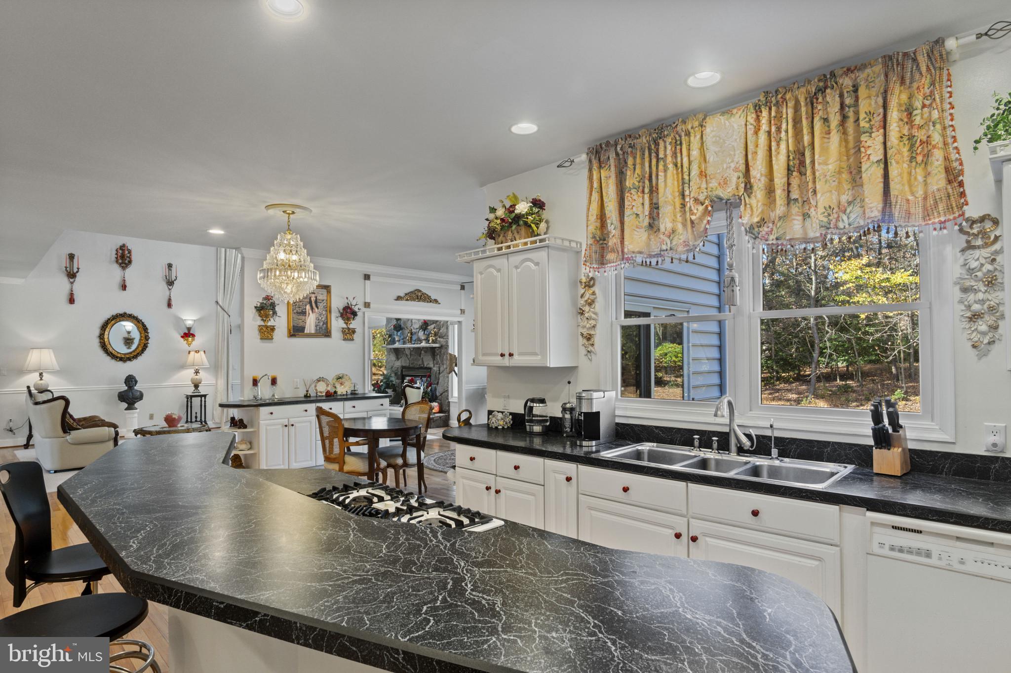 10900 Sunset Hills Road Reston, VA 20190 - Photo 31 of 62 a kitchen with counter space and windows