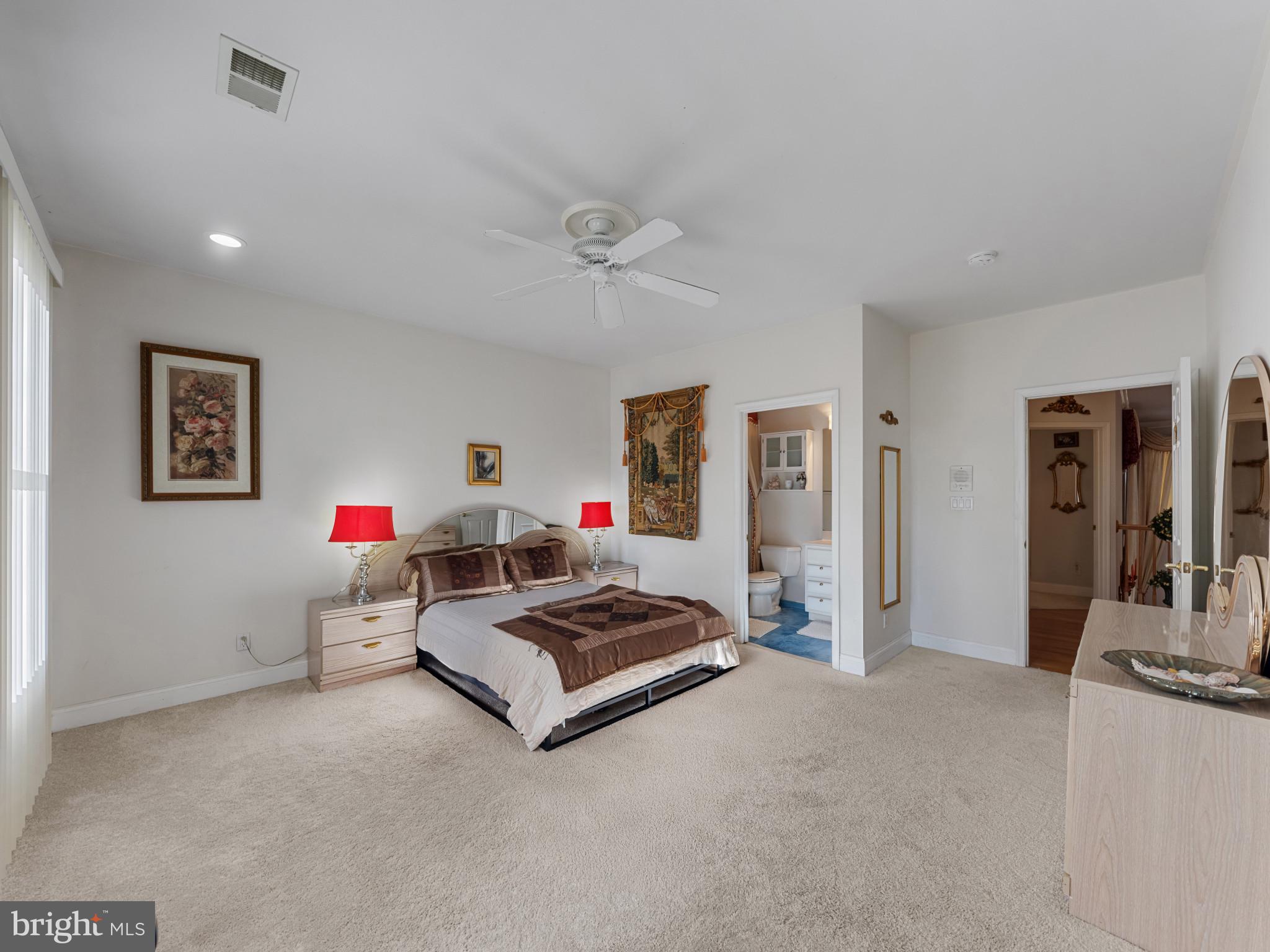 10900 Sunset Hills Road Reston, VA 20190 - Photo 34 of 62 a living room with furniture and a flat screen tv