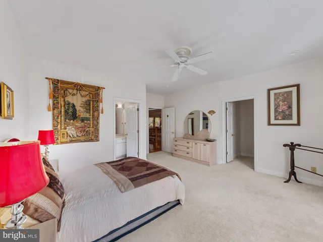 a bathroom with a sink mirror vanity and toilet