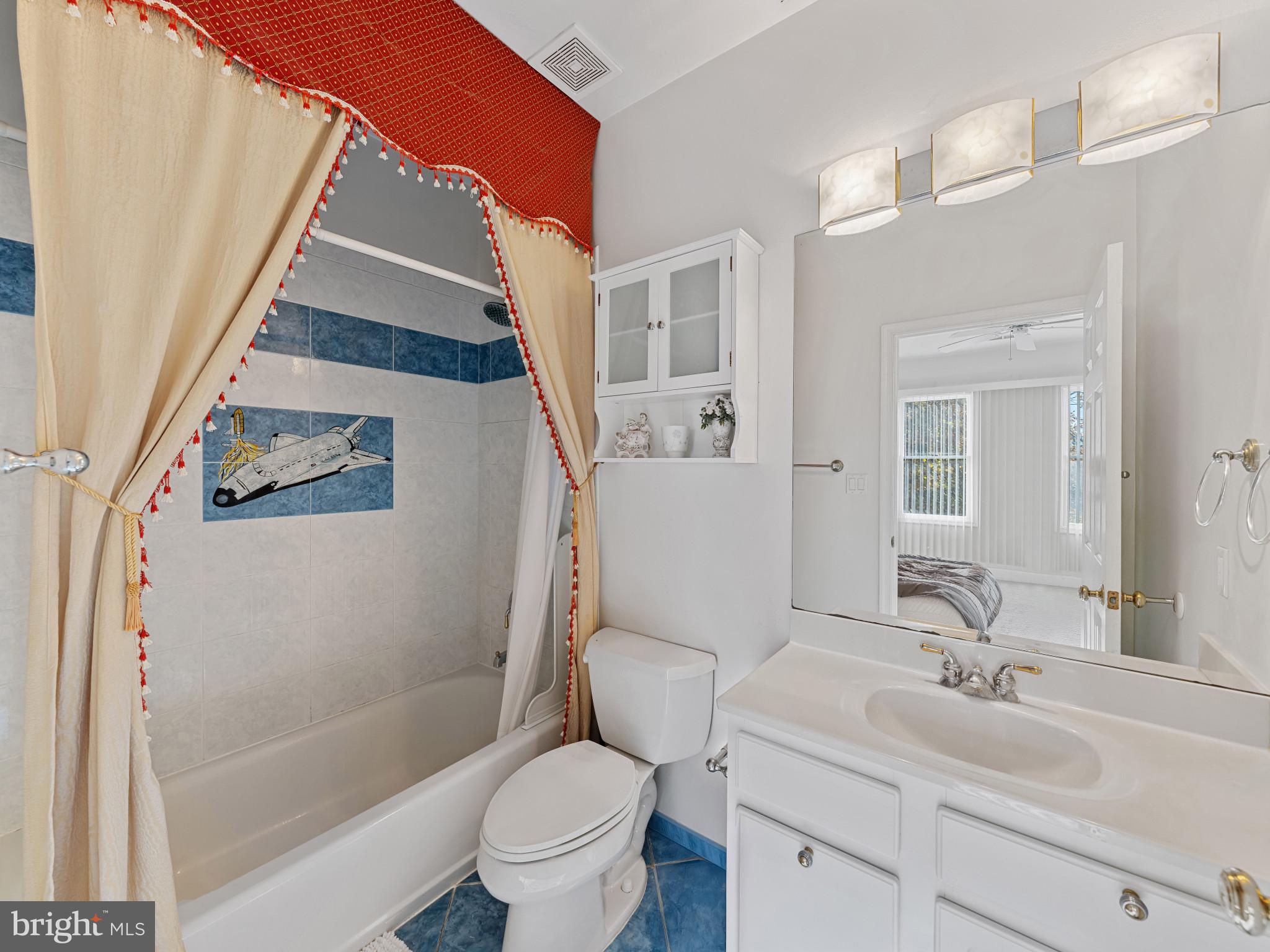 10900 Sunset Hills Road Reston, VA 20190 - Photo 36 of 62 a white toilet sitting next to a bathroom sink