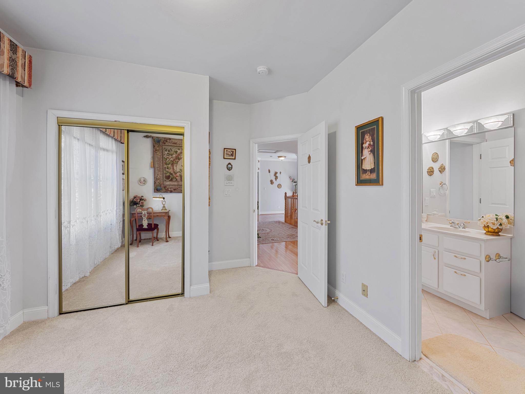 10900 Sunset Hills Road Reston, VA 20190 - Photo 38 of 62 a view of a hallway with bathroom and glass door