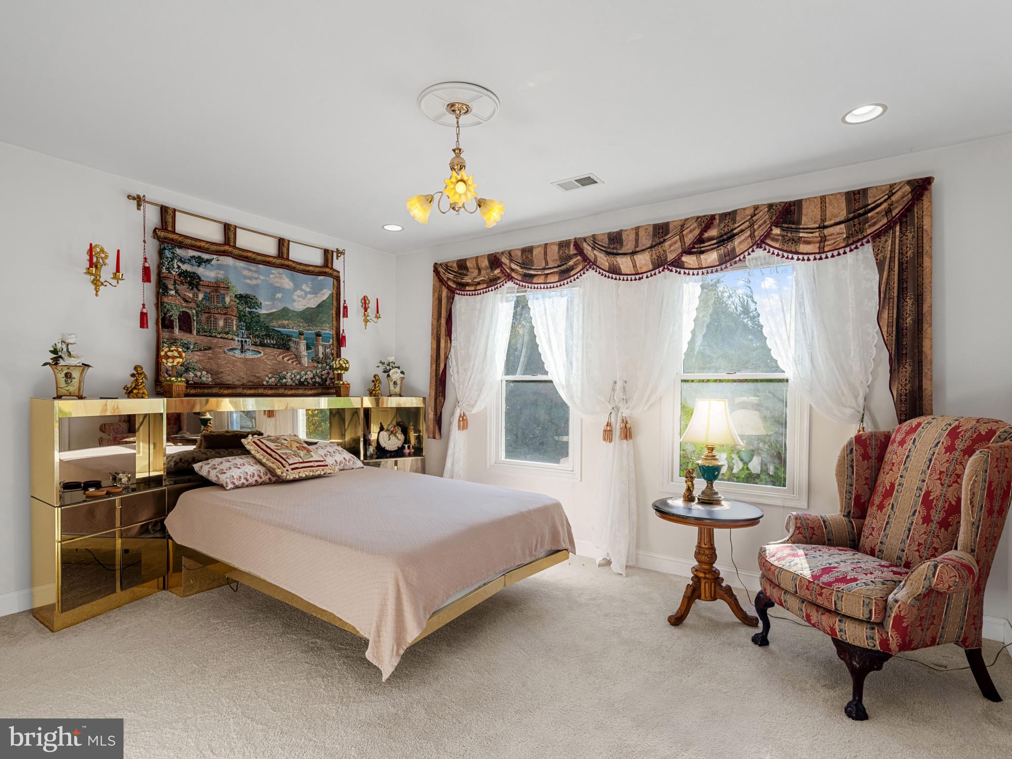 10900 Sunset Hills Road Reston, VA 20190 - Photo 40 of 62 a bedroom with a bed and a couch