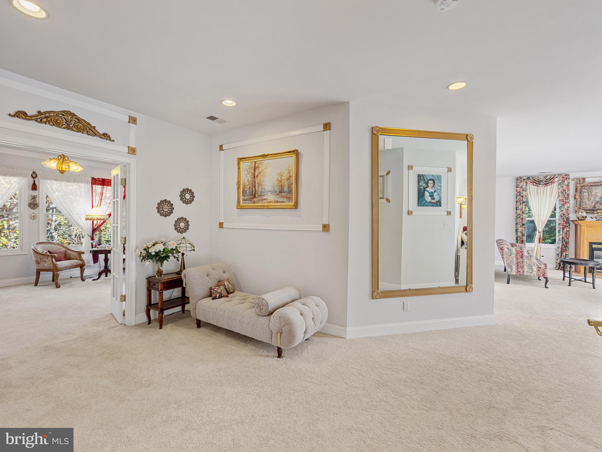 10900 Sunset Hills Road Reston, VA 20190 - Photo 42 of 62 a living room with furniture and a table