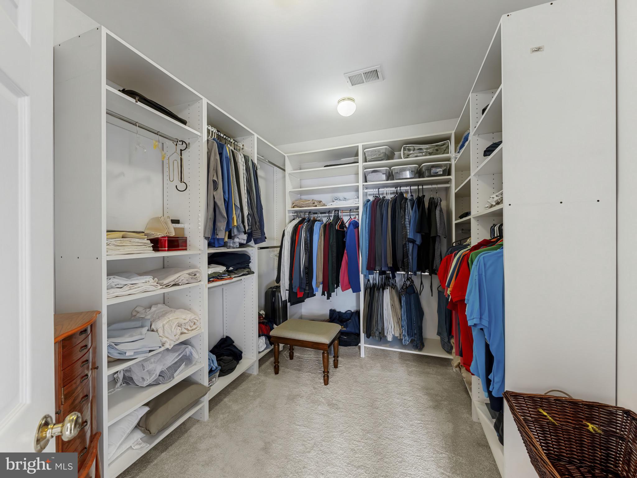 10900 Sunset Hills Road Reston, VA 20190 - Photo 46 of 62 a view of walk in closet with clothes and shoes