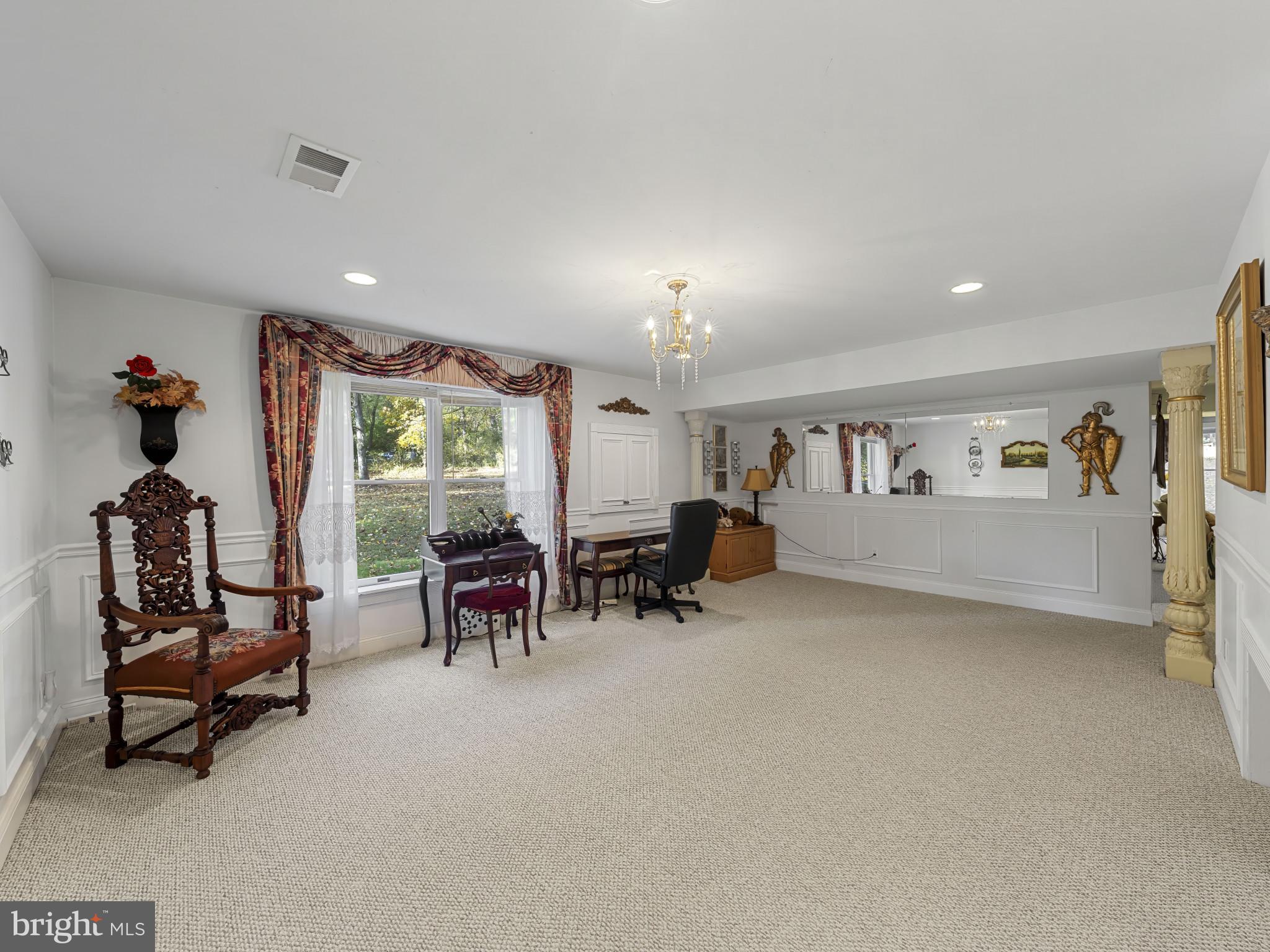 10900 Sunset Hills Road Reston, VA 20190 - Photo 50 of 62 a living room with furniture and a fireplace
