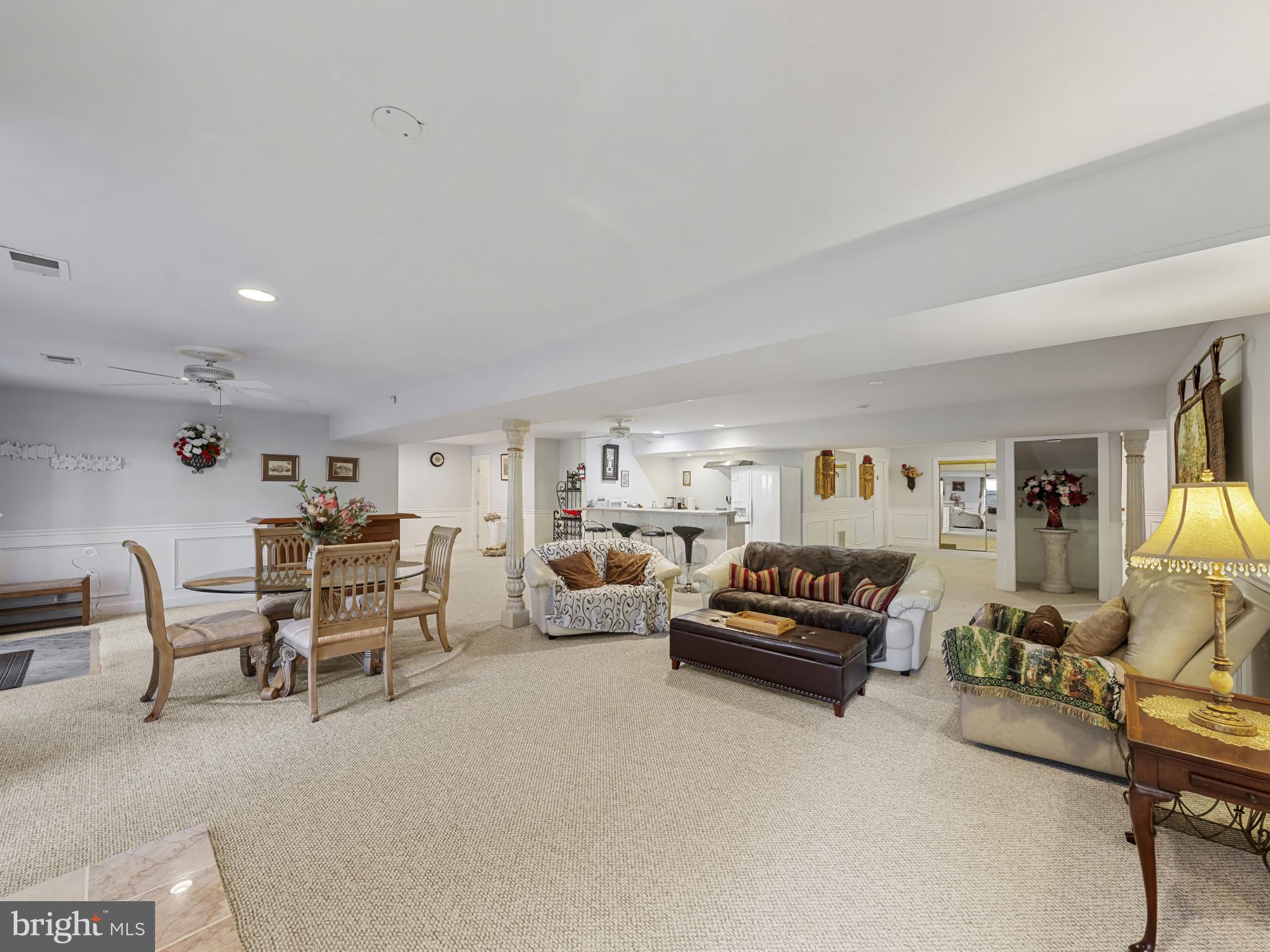 10900 Sunset Hills Road Reston, VA 20190 - Photo 52 of 62 a living room with furniture and a flat screen tv
