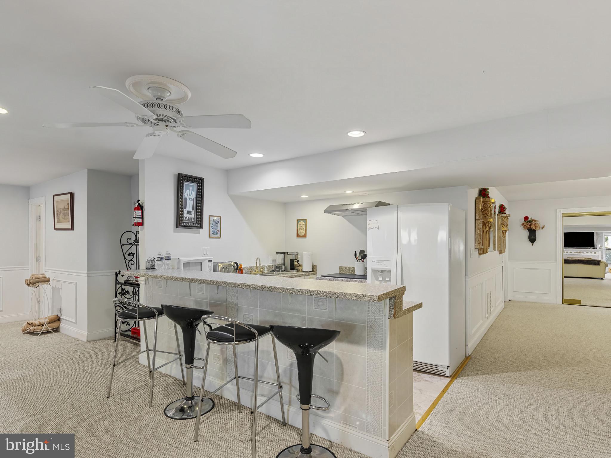 10900 Sunset Hills Road Reston, VA 20190 - Photo 53 of 62 a kitchen with a table and chairs in it