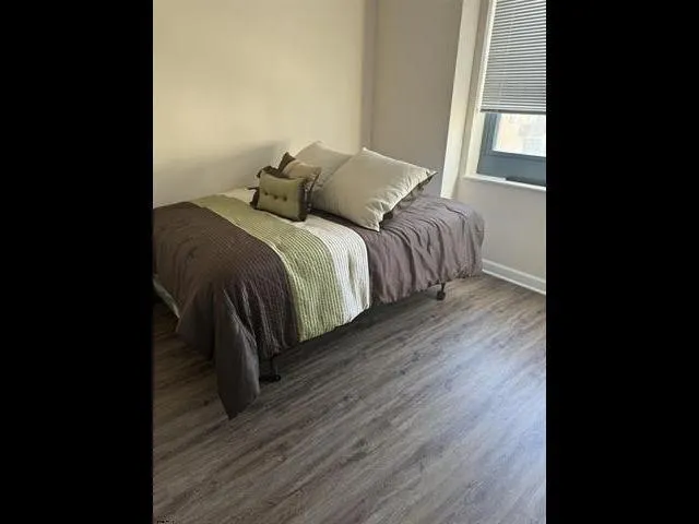 a bathroom with a shower a toilet and a sink