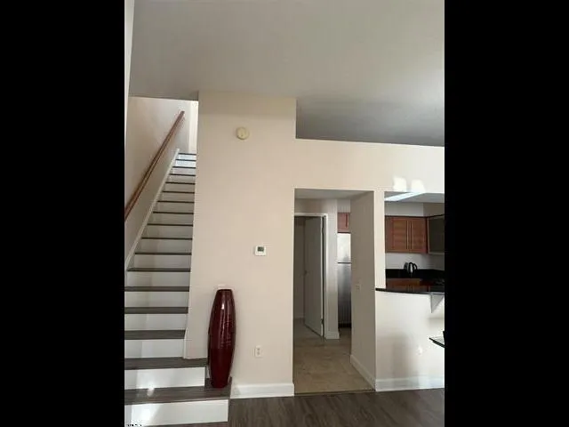 a living room with furniture and painted walls