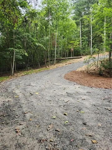 a backyard of a house with lots of green space and stainless steel appliances