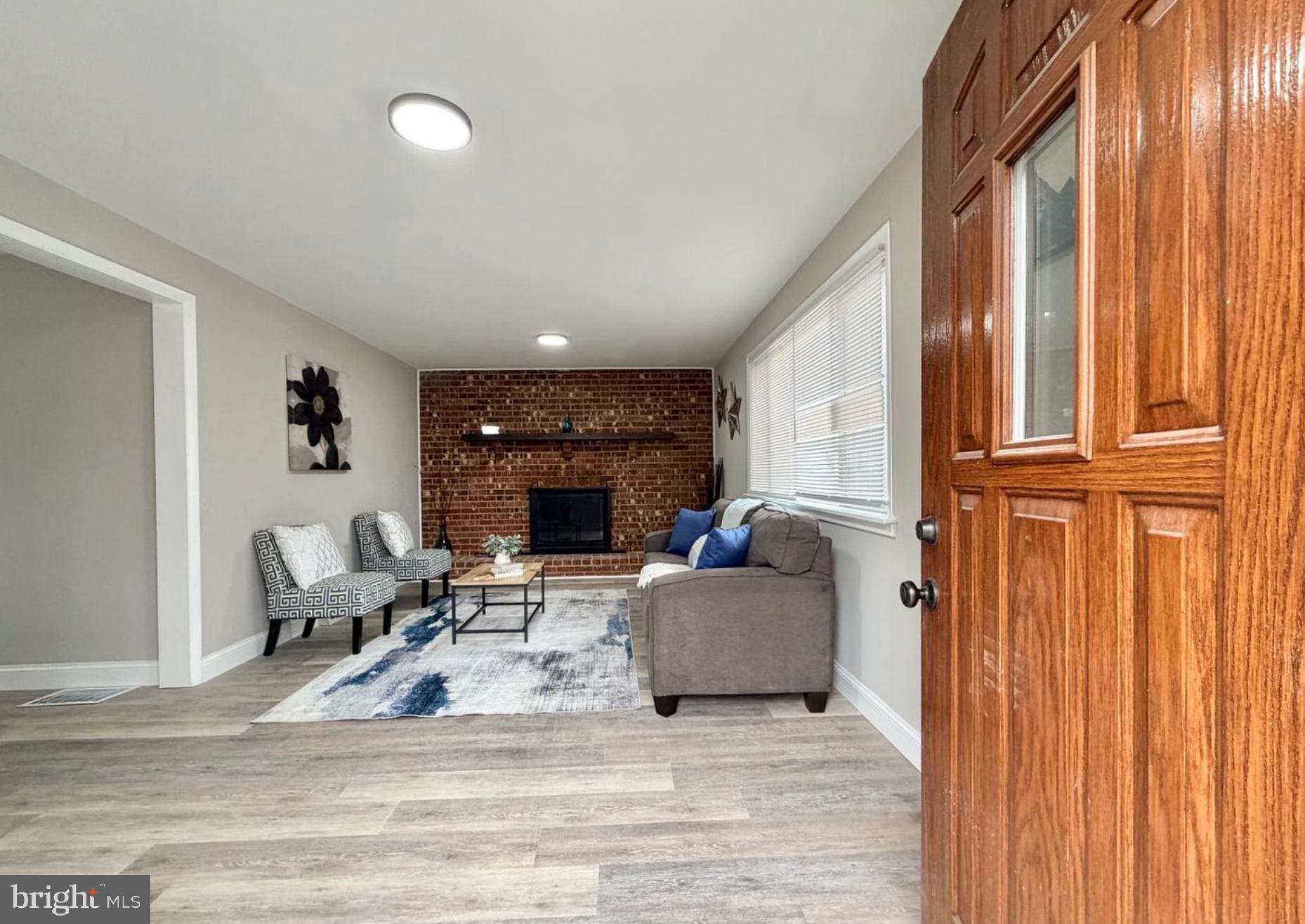 31 Mantua Road Mount Royal, NJ 08061 - Photo 2 of 11 a living room with furniture window and a fireplace