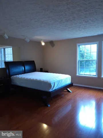 a view of a livingroom with furniture and wooden floor
